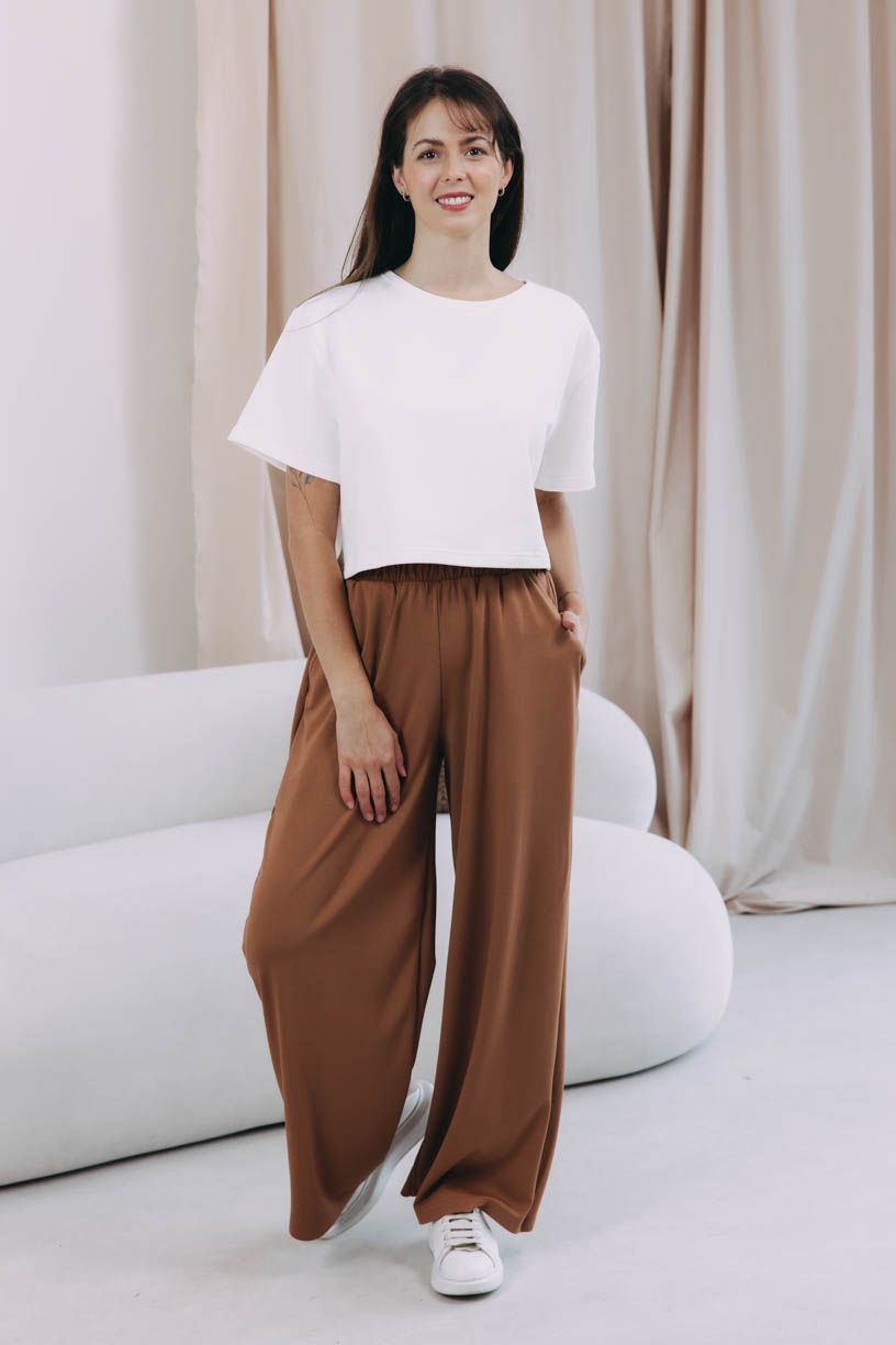 Káťa má na sobě při své výšce 170 cm velikost XS/S.