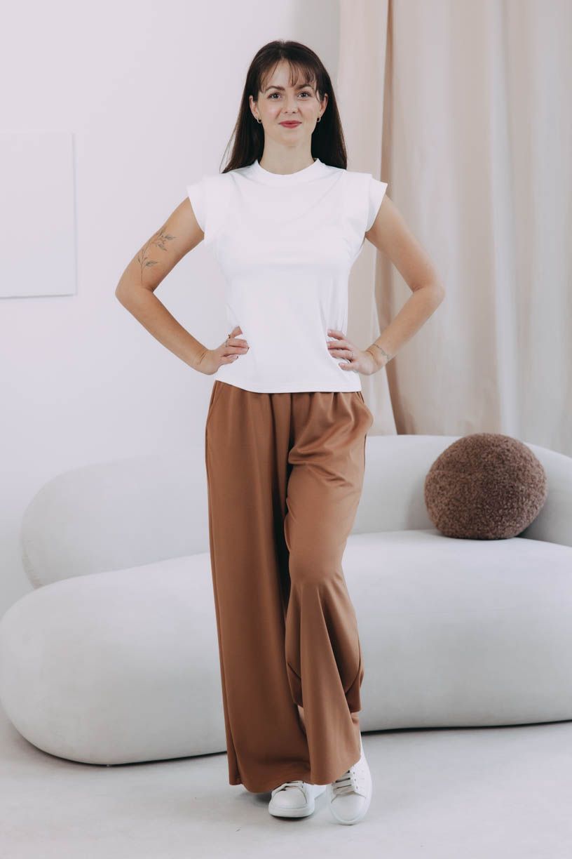 Káťa má na sobě při své výšce 170 cm velikost XS.